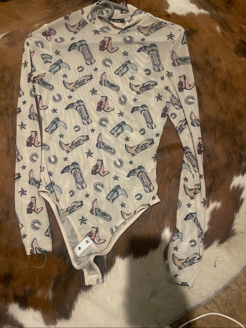 size s boots and horseshoe body suit